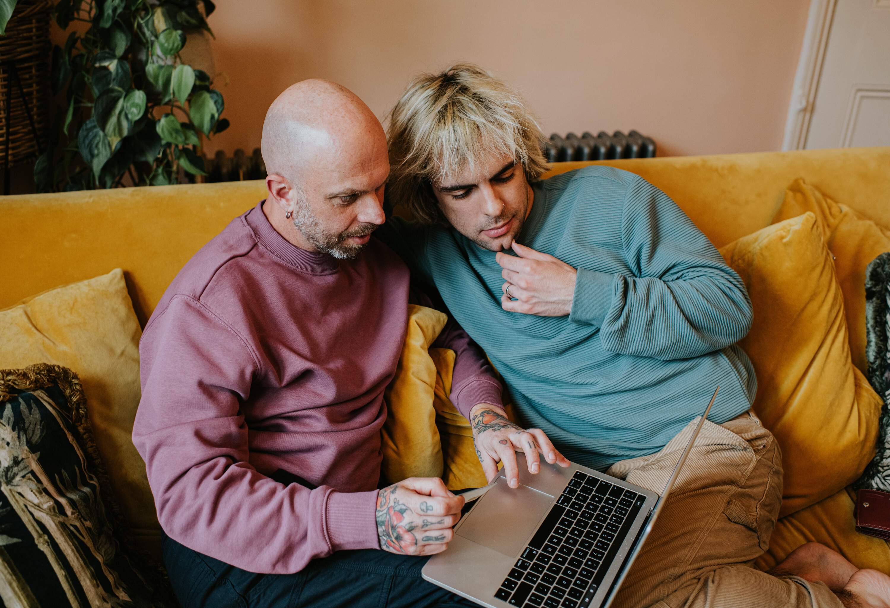 theme_lgbtq_gay_couple_laptop_uk_gettyimages-1391657397
