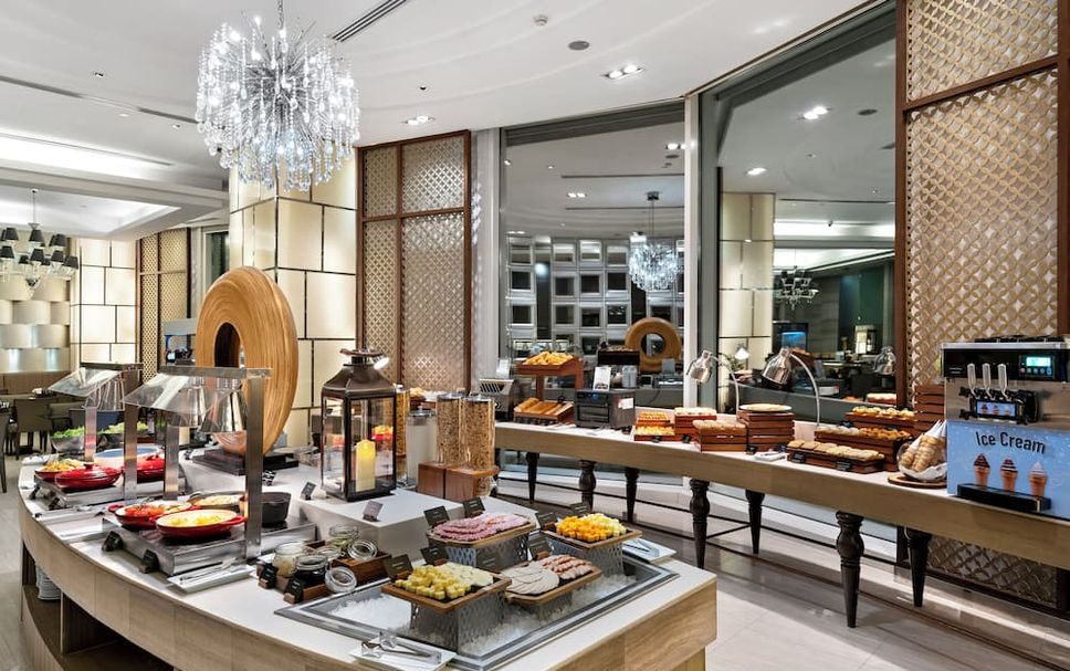 Hotel breakfast buffet with hot and cold food stations